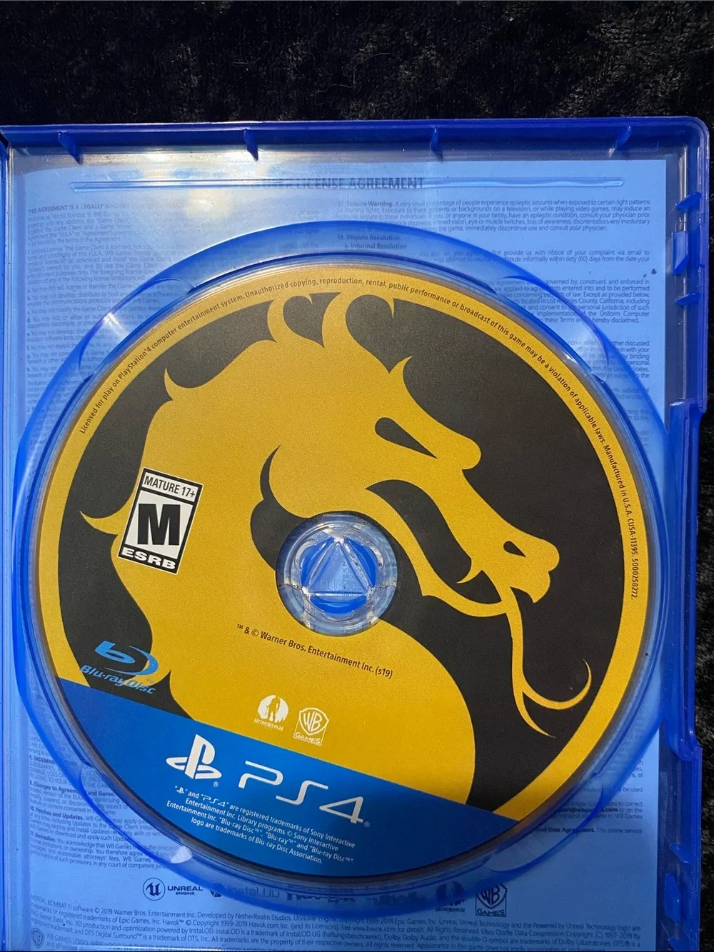 Sony PS4 Game Case with Blue Shell and Yellow Accents
